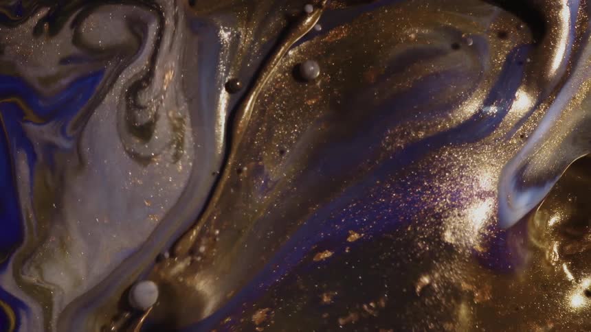 A colorful abstract liquid moving with some metallic bubbles