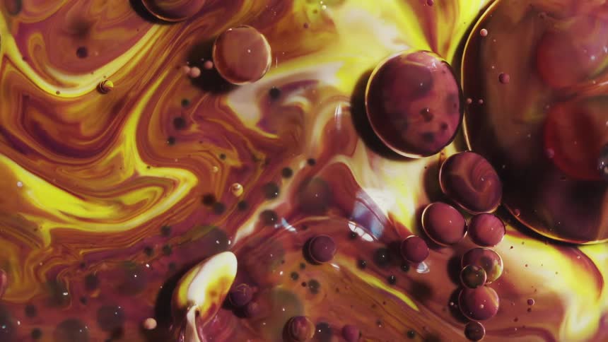 Extreme closeup of ink liquid with abstract and slowmoving bubbles