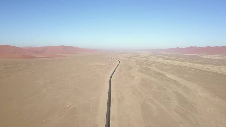 A long road across a large stretch of desert
