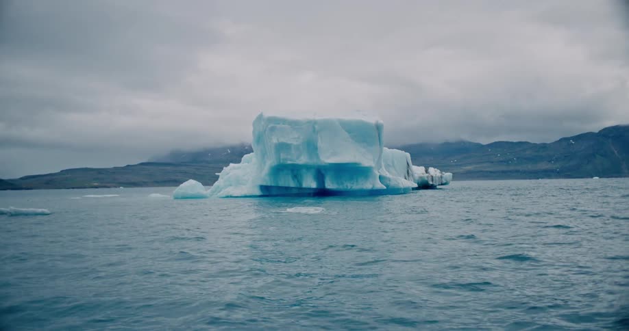 An iceberg melting in a body of water