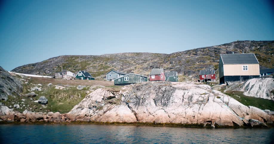 A small coastal town with houses on the hill