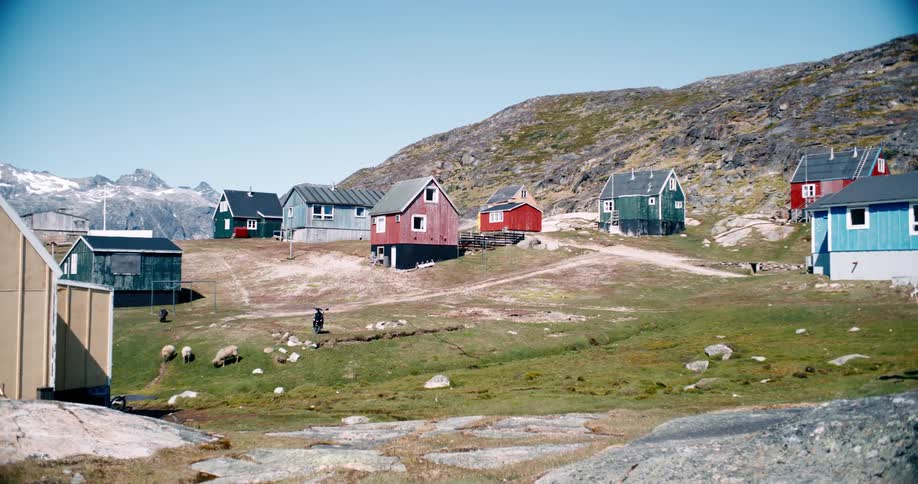 Colorful rural cabins on hillside during the day