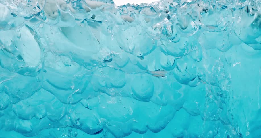 Wall of clear blue ice on a glacier or iceberg