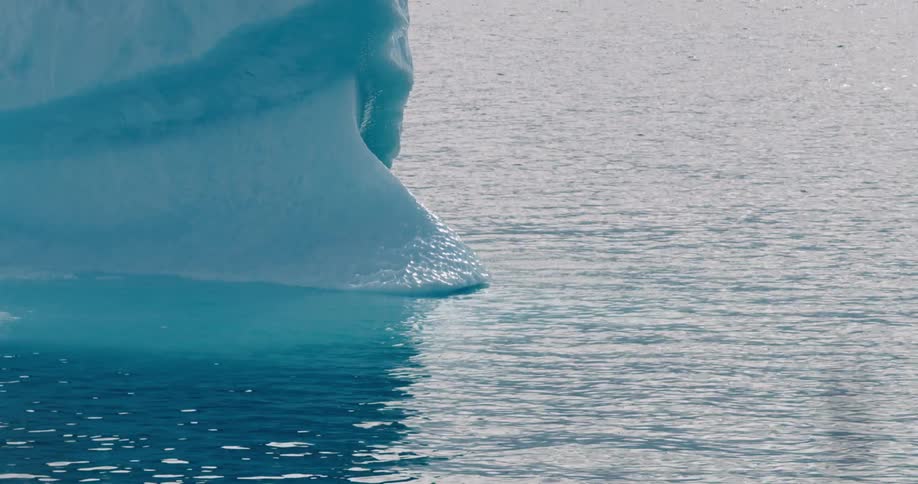 A large chunk of ice sitting on the sea