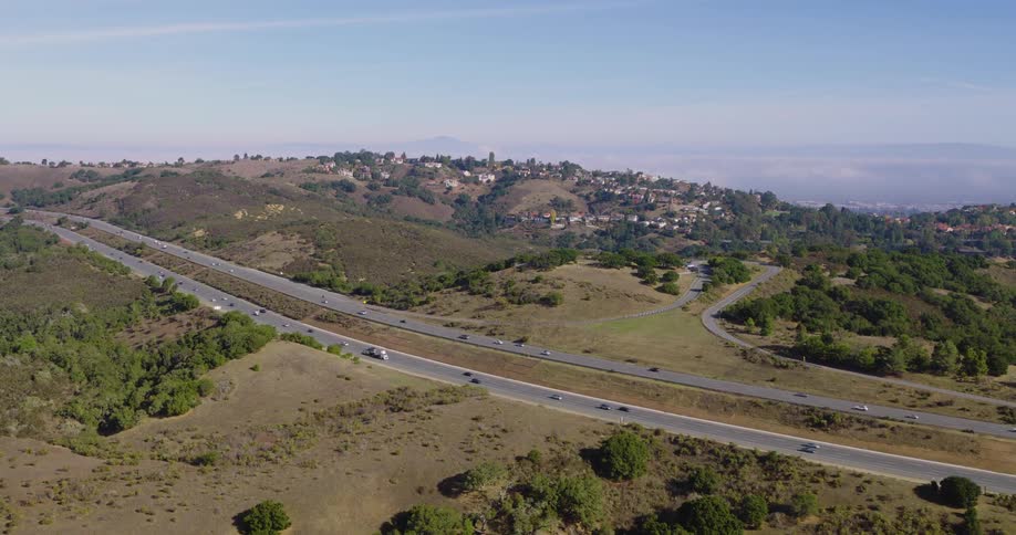 Aerial view of freeway and landscape with trees