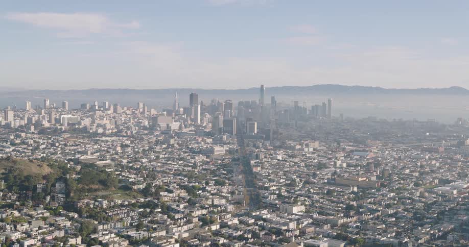 Aerial view of neighborhoods and distant skyscrapers in the city
