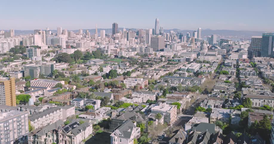 A city with all white buildings is shown from an aerial view