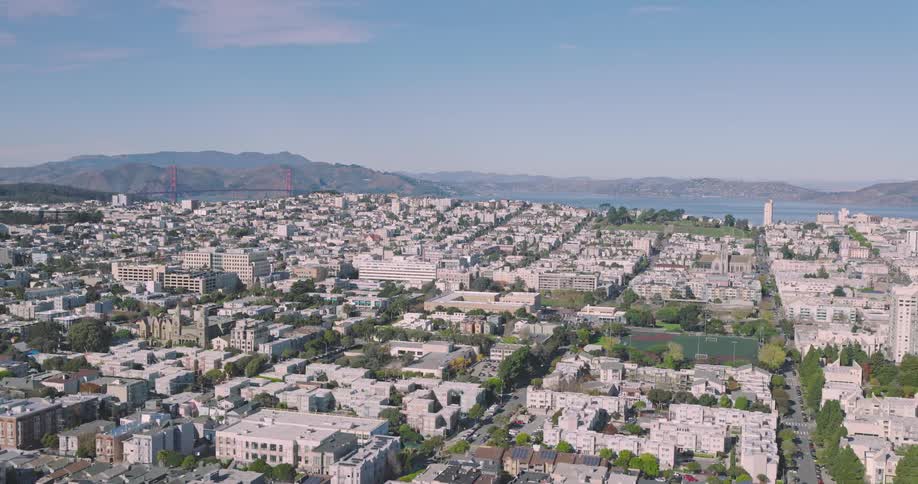 Aerial panorama of an urban city with houses and apartments by the seaside