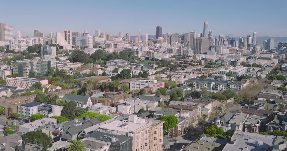 An aerial view showcasing distant high buildings and houses in the neighborhood