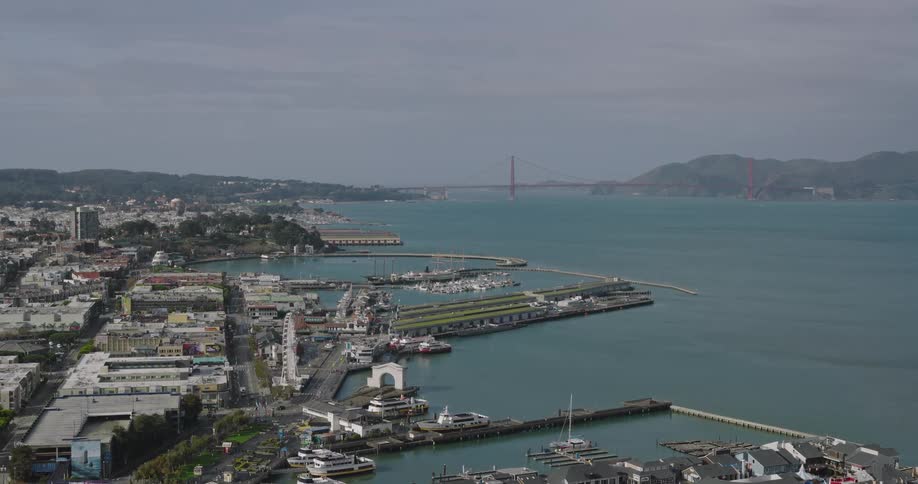 Skyline of a coastal city with ships docked at the marina