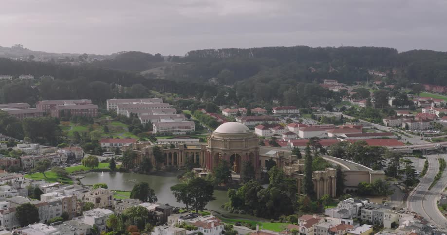 A large domed building is in the middle of the city