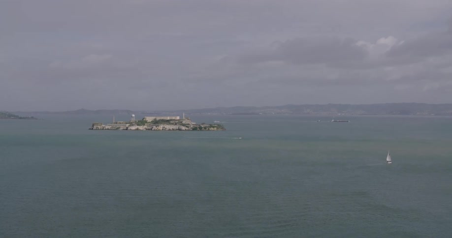 Aerial panorama of an island in the midst of the sea on a cloudy day