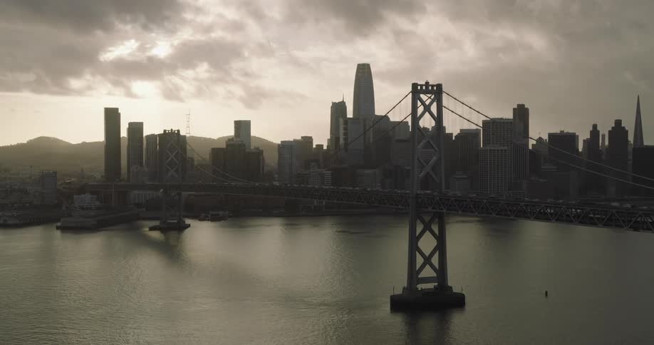 View of a metropolis with skyscrapers bridges over lakes on a cloudy day