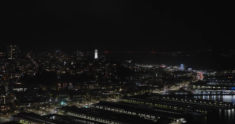 Aerial view of a coastal city at night