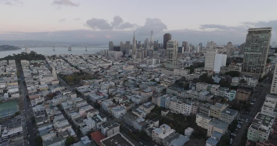 Low aerial of downtown san francisco and the bay in the early morning just as the sun is starting rise