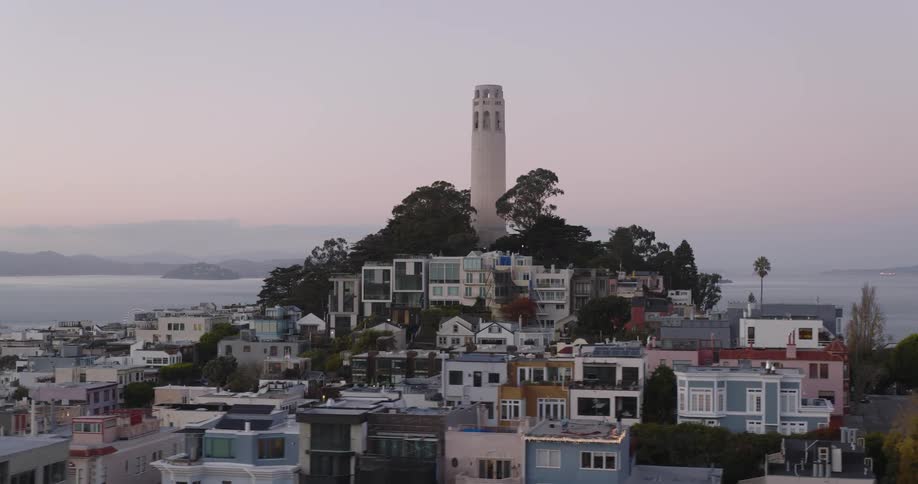 Panorama of an urban city by the sea under a purple dawn sky