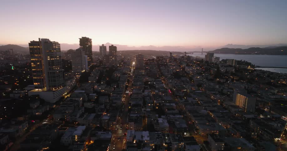 Aerial view of an illuminated coastal metropolis