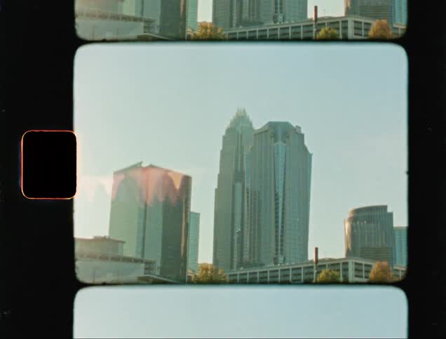 Skyscrapers on the city caught on vintage film