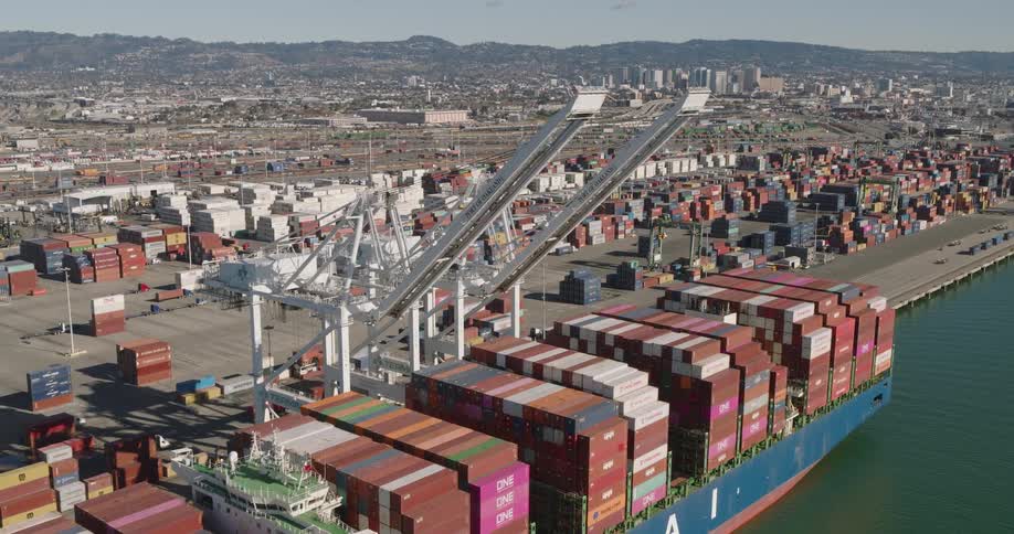 Aerial of a cargo ship anchored in the citys port during the day