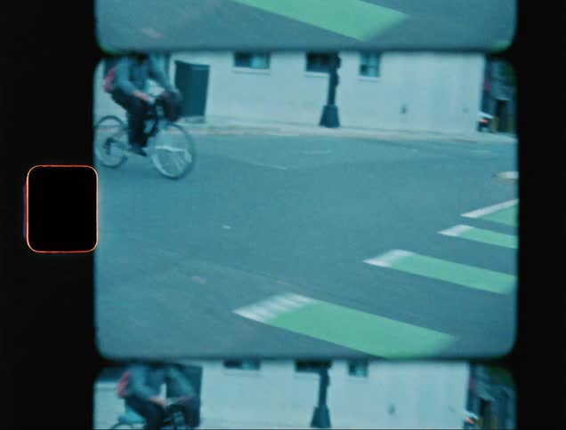 Bicycle on the city streets caught on vintage film