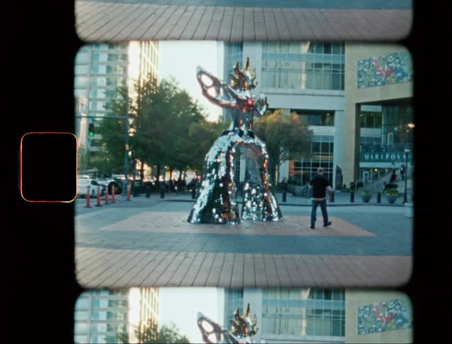 Square in the midst of a metropolis with christmas decorations in daylight
