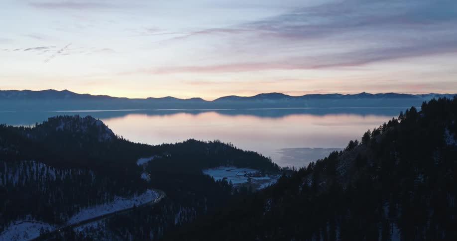 Aerial view of a lake in the mountains at sunset
