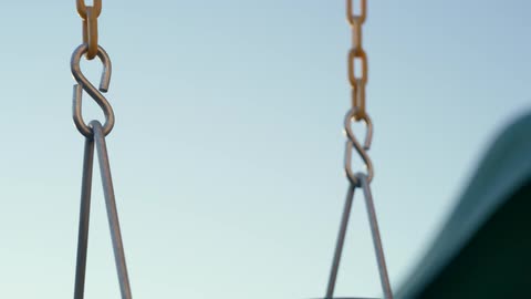 The sing is hanging in the empty playground