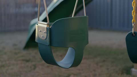 Swing set on a playground a morning