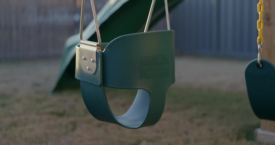 Swing set on a playground a morning