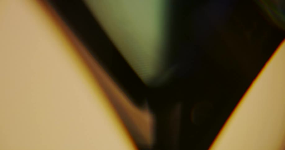 Close up of geometric shapes swinging