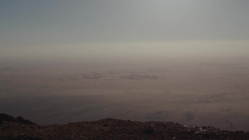 A view of an endless horizon in Abu Dhabi as the camera moves through metal rails