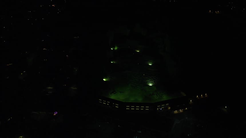 Aerial view of golf practice facilities at night