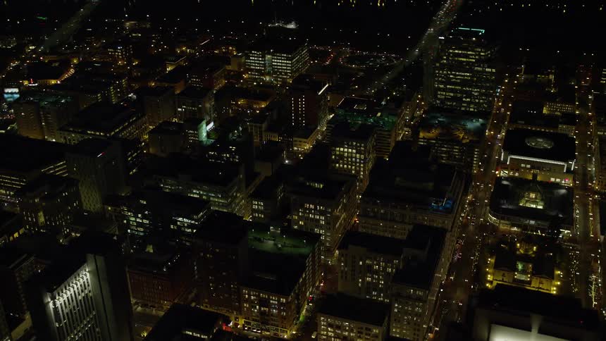 Skyline of illuminated buildings at night in metropolitan city