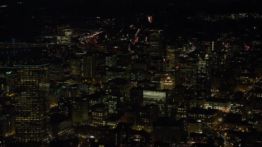 Aerial view of illuminated skyscrapers and high rise buildings in the city