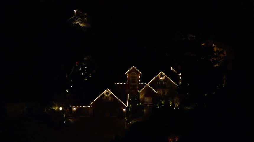 A night aerial clip of a community