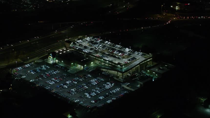 Aerial view of a parking garage at night