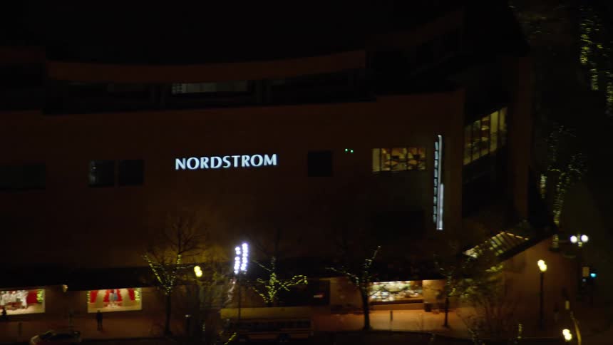 The buildings are brightly lit at night