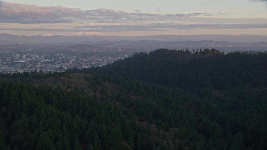 Aerial view of a city in a valley at evening