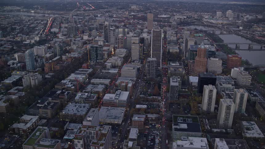 Aerial view of a waterfront city at evening