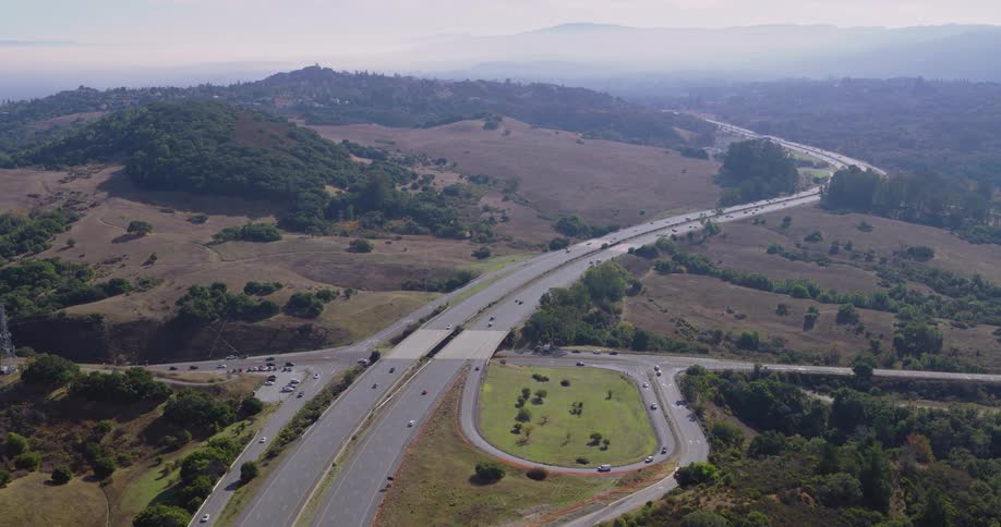Cars travel on the highway on the hills