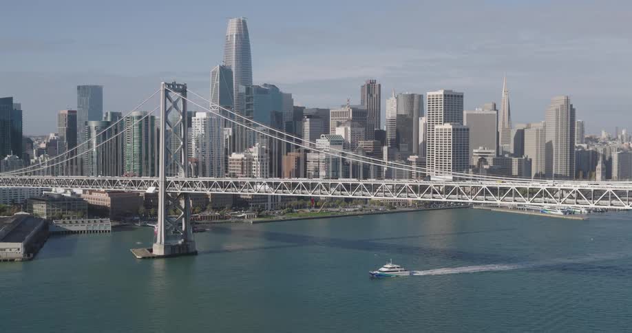 Aerial of a bridge spanning san francisco bay on a partly sunny day