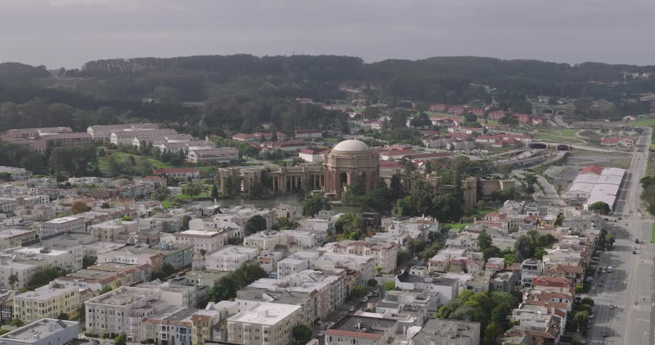 A large domed building is in the city