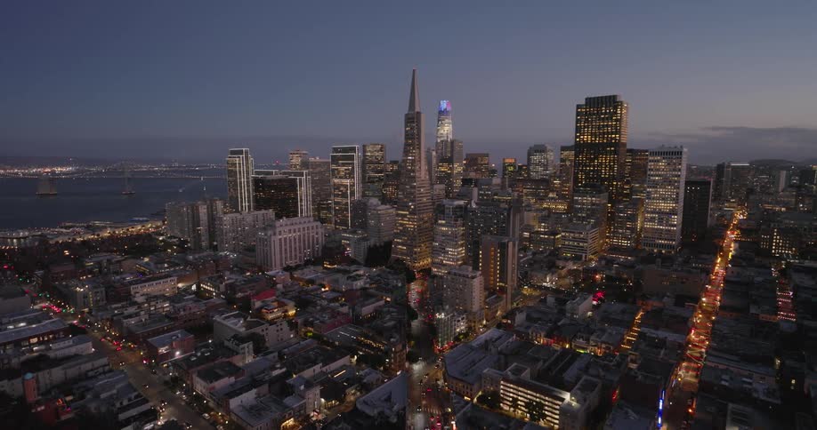 Aerial view of illuminated skyscrapers in the evening in the city