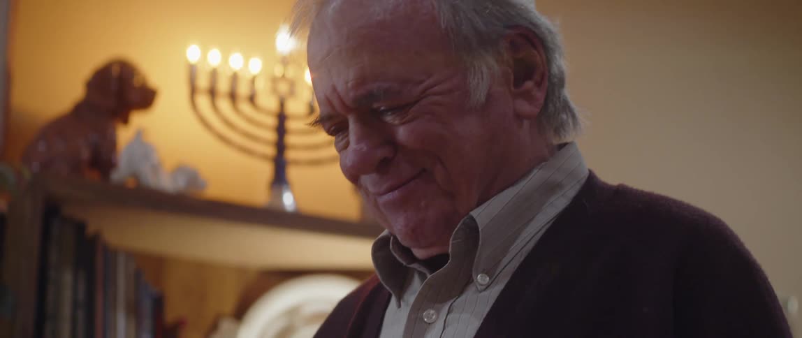 Elderly jewish man fervently praying at home