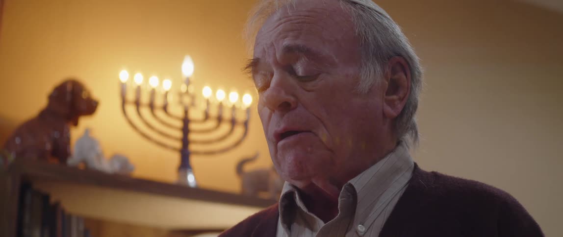 A clip of an old man praying