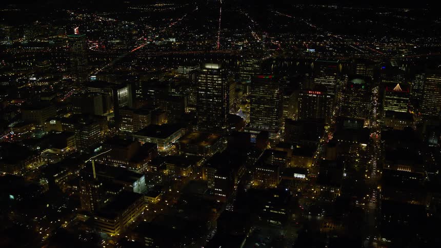 Aerial view of illuminated buildings in the city at night