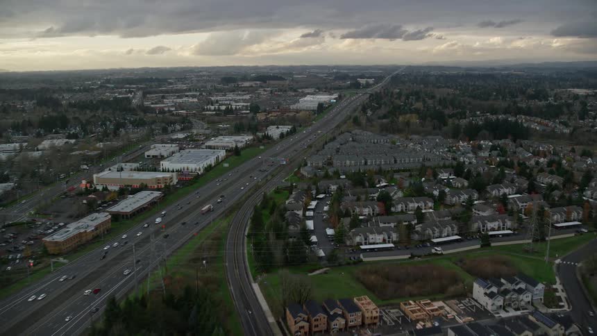 Aerial panorama of a highway in the midst of an urban city on a cloudy day