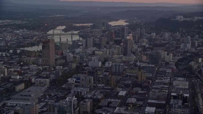 Aerial view of a gray and gloomy city with lots of buildings