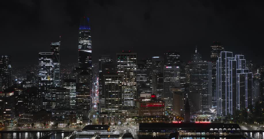 The city glows with electric lights during the night