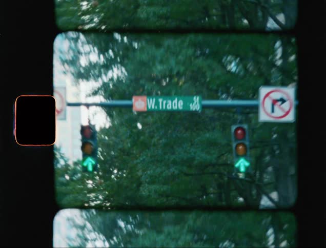 Street signs and traffic lights in the city caught on vintage film